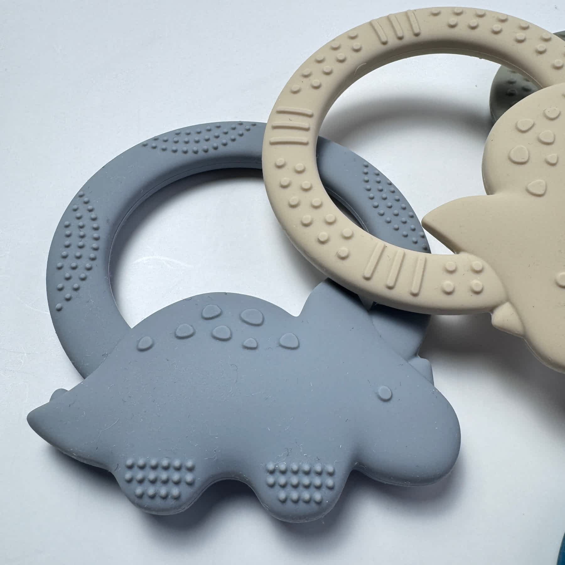 Stone Blue and Sandy Dinosaur Silicone Teether for Babies & Safe Soothing for Teething Relief